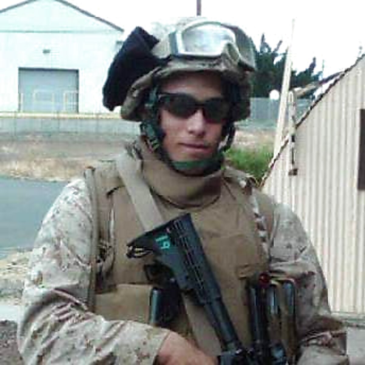 Markus in full Marine Corps combat gear with a rifle